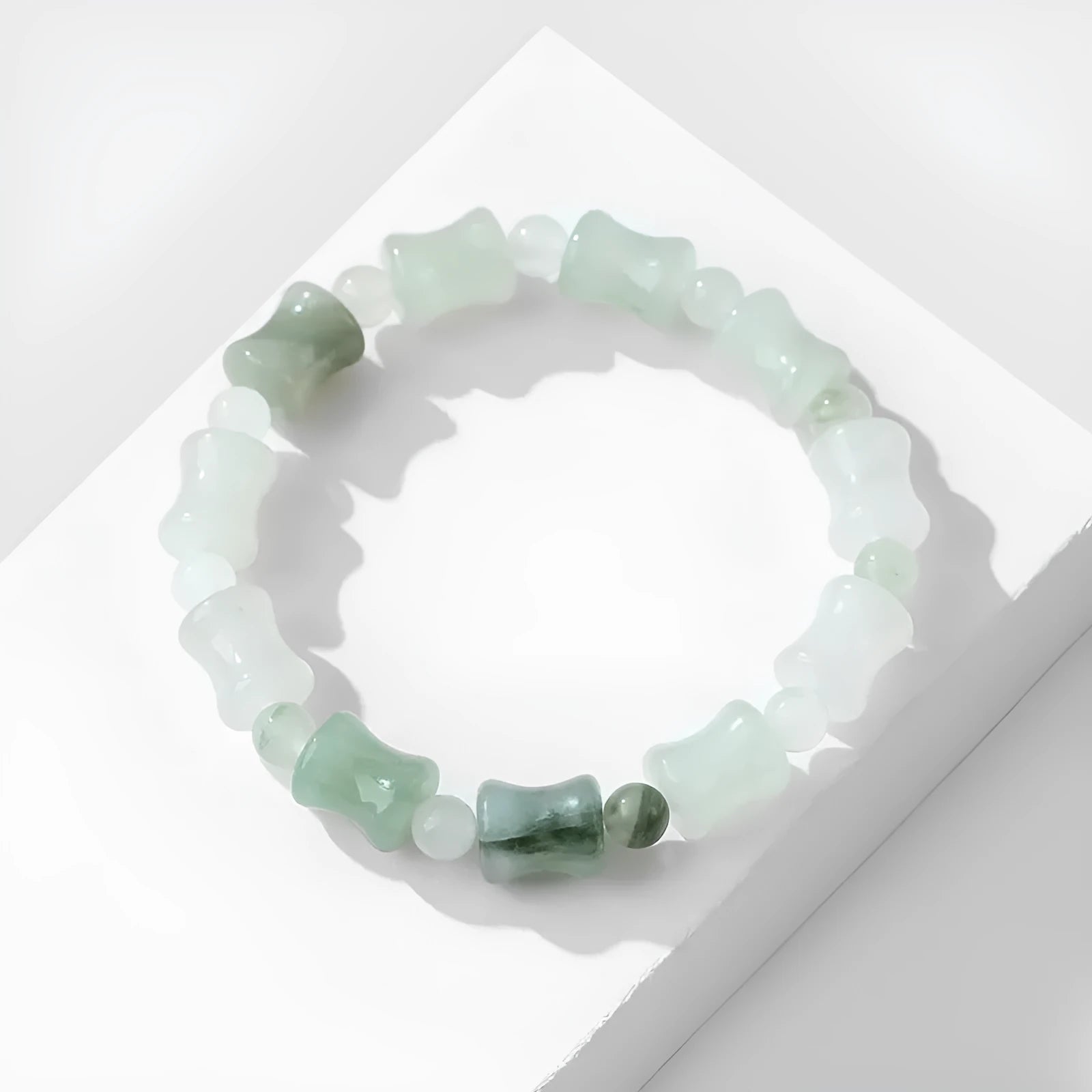 Tianshan Emerald and natural chalcedony diamond-cut beaded bracelet with coconut shell beads and a safety lock.
