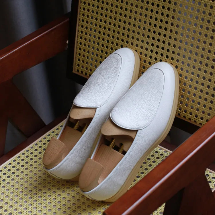 Men's handmade brown leather loafers with a low tube design and light TPR sole.