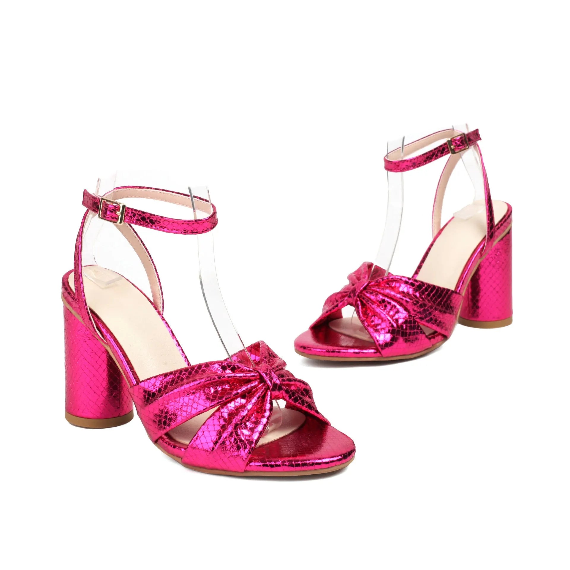 Gold women's high heel peep toe sandals with an ankle buckle on a white background.