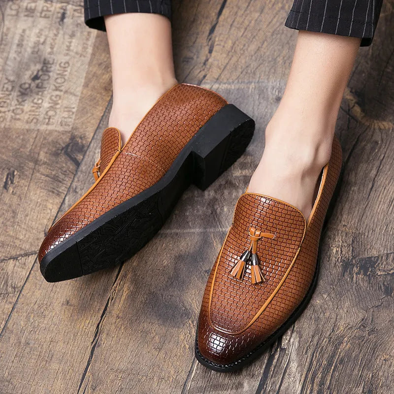 Men's black pointed slip-on shoes with tassel detail on a low-top PU upper