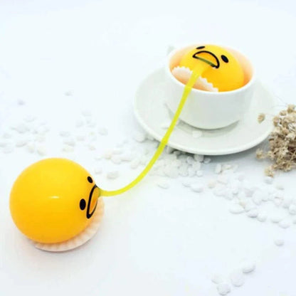 Gudetama Vomiting Egg Toy in green, orange, pink, and yellow