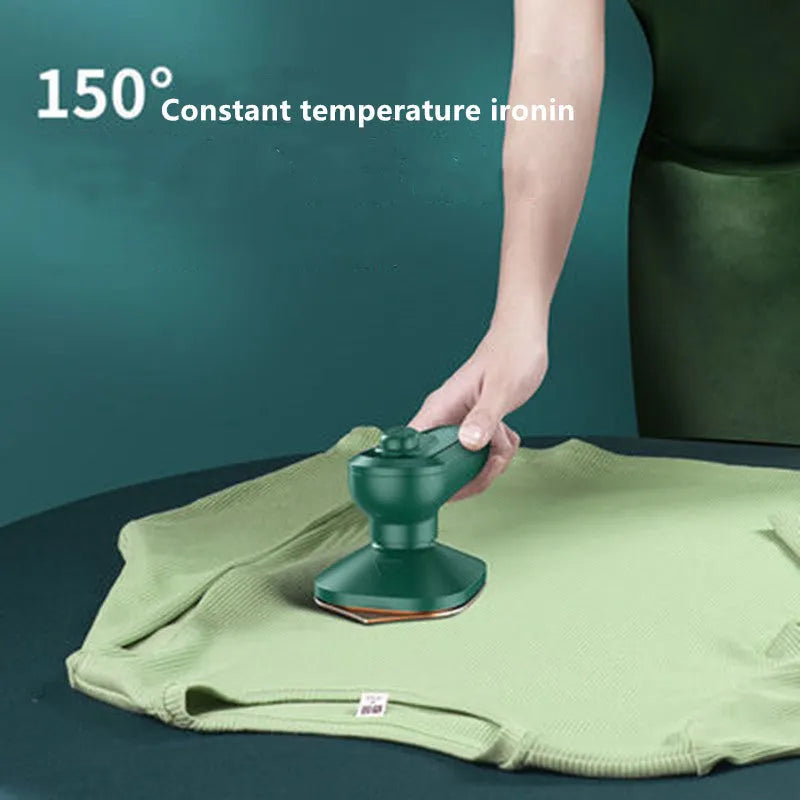 Dark green portable hanging steam iron with ceramic panel and compact design for travel use