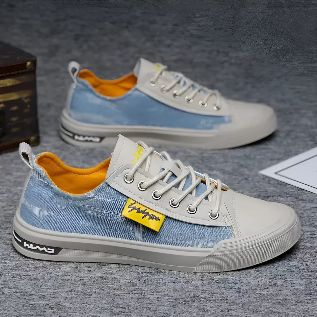 Men's casual canvas lace-up shoes with round toe in black, dark blue, or light blue on a rubber sole.
