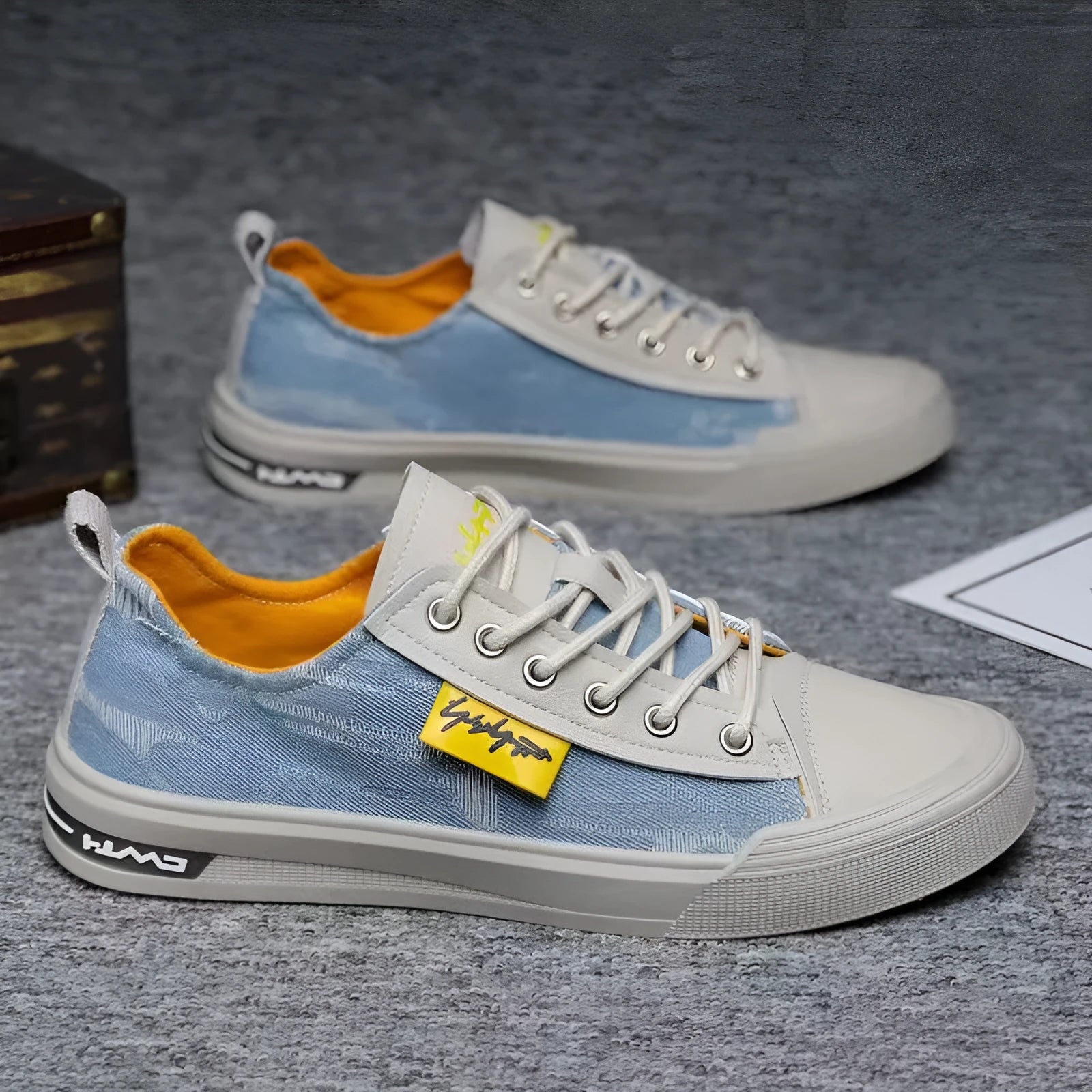 Men's casual canvas lace-up shoes with round toe in black, dark blue, or light blue on a rubber sole.