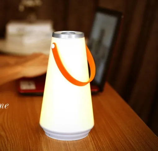 White rechargeable LED bedside lamp with warm light and adjustable brightness settings