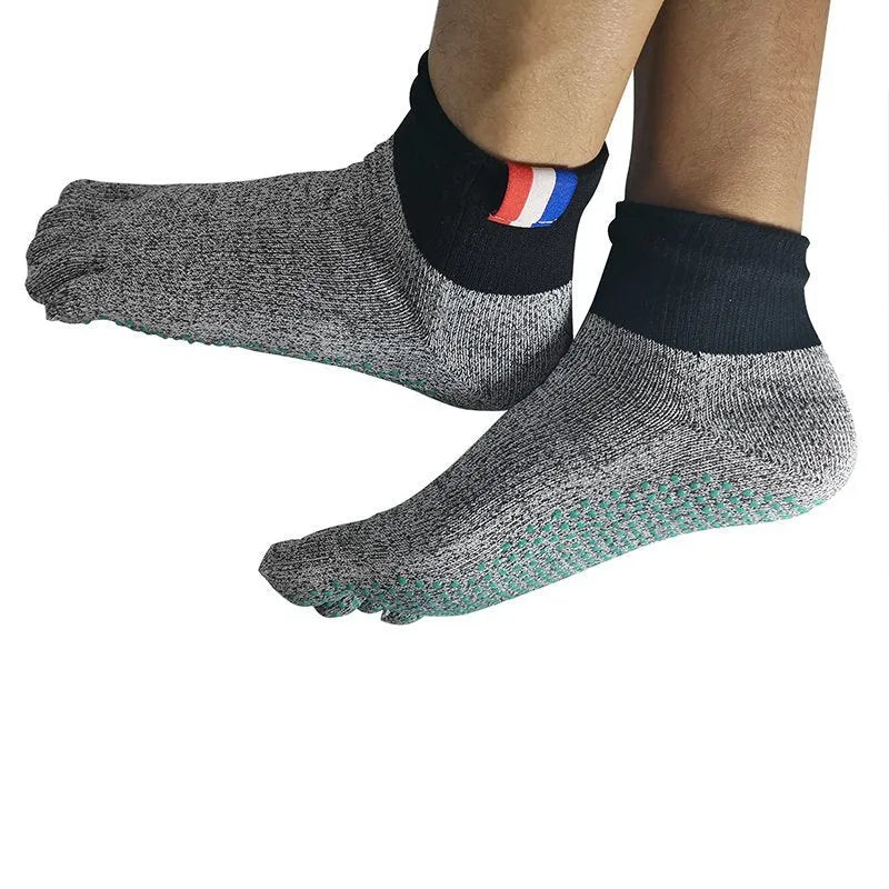 Grey five-toe cut-resistant anti-slip beach socks with non-slip silica gel sole against a neutral background