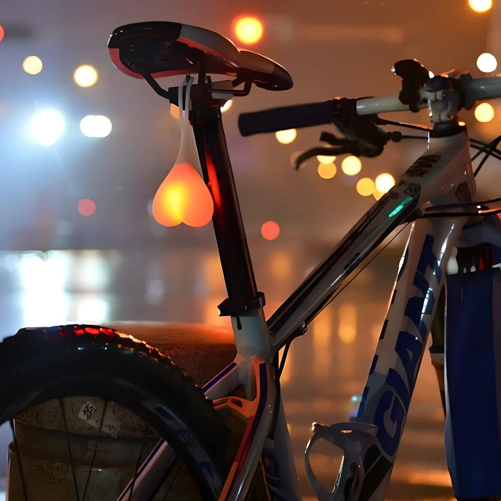 Blue beating heart silicone bike rear light, 15 cm long, touch-activated and waterproof for night cycling safety