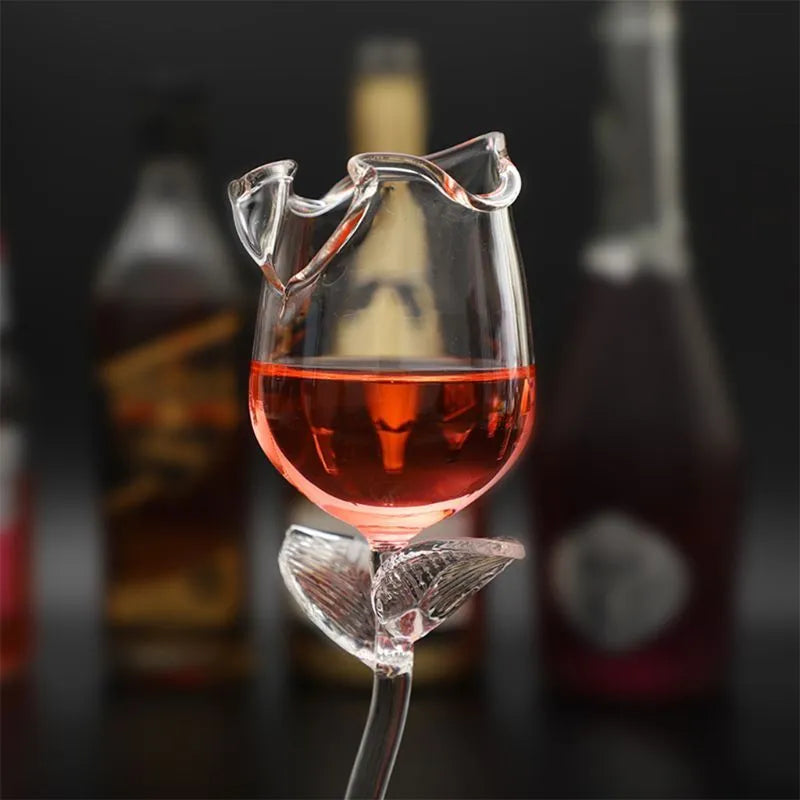 Fancy red wine goblet with rose flower shape and 100ml transparent glass on table