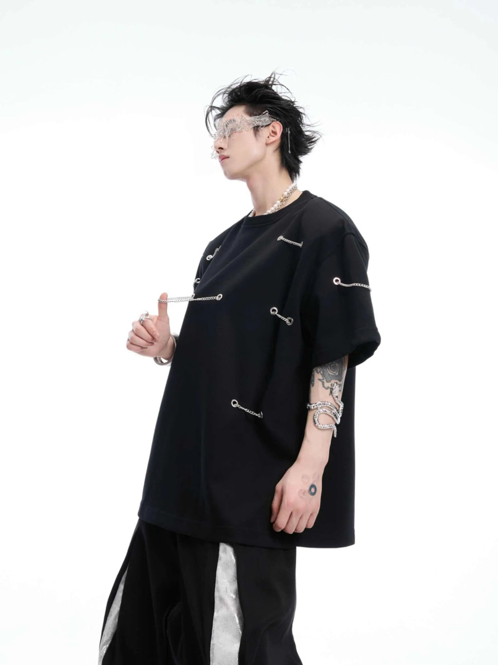Black heavy cotton t-shirt with padded chain shoulder detail on short sleeves