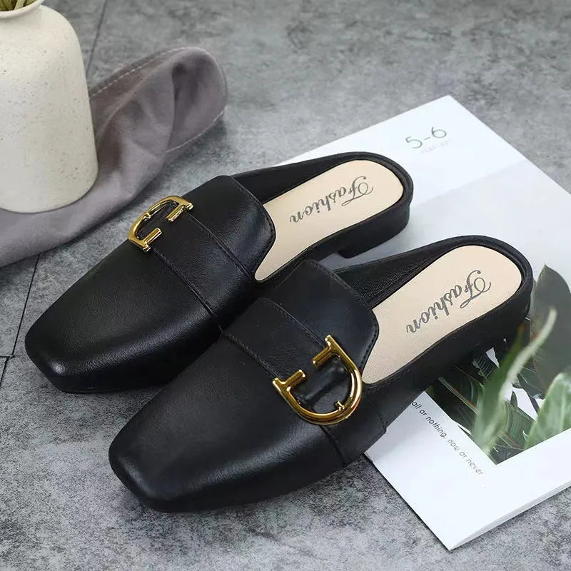 Women's PVC closed toe half slippers shown in milky white colour with a double buckle fastener.