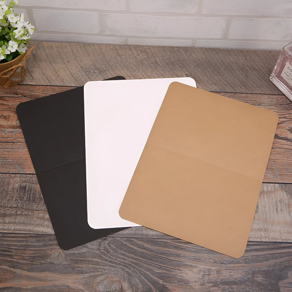 A pack of 100 folded kraft paper greeting cards in 10x15cm size, showing colour options: black, cowhide brown, and white.