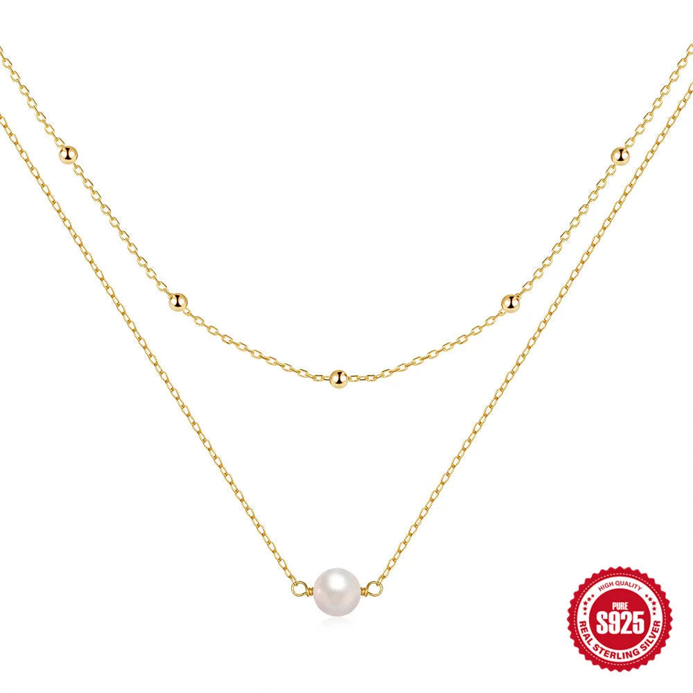 S925 sterling silver necklace with double-layer twin pearl pendant on a ball bead chain, shown in gold colour.