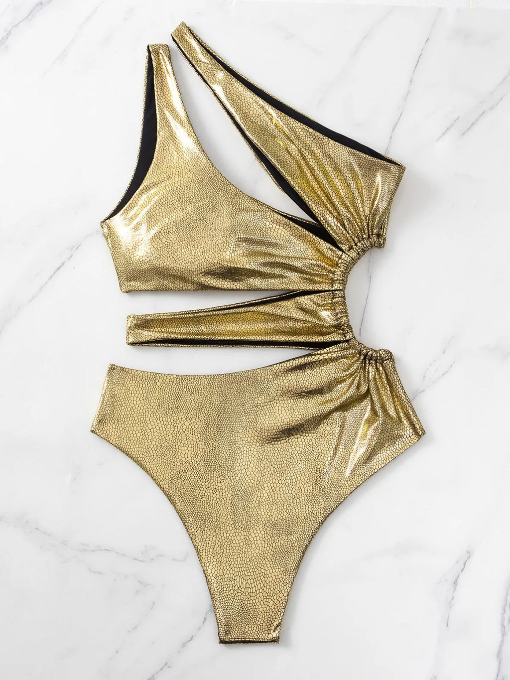 Gold women's one-piece swimsuit with backless design and spandex construction for swimming