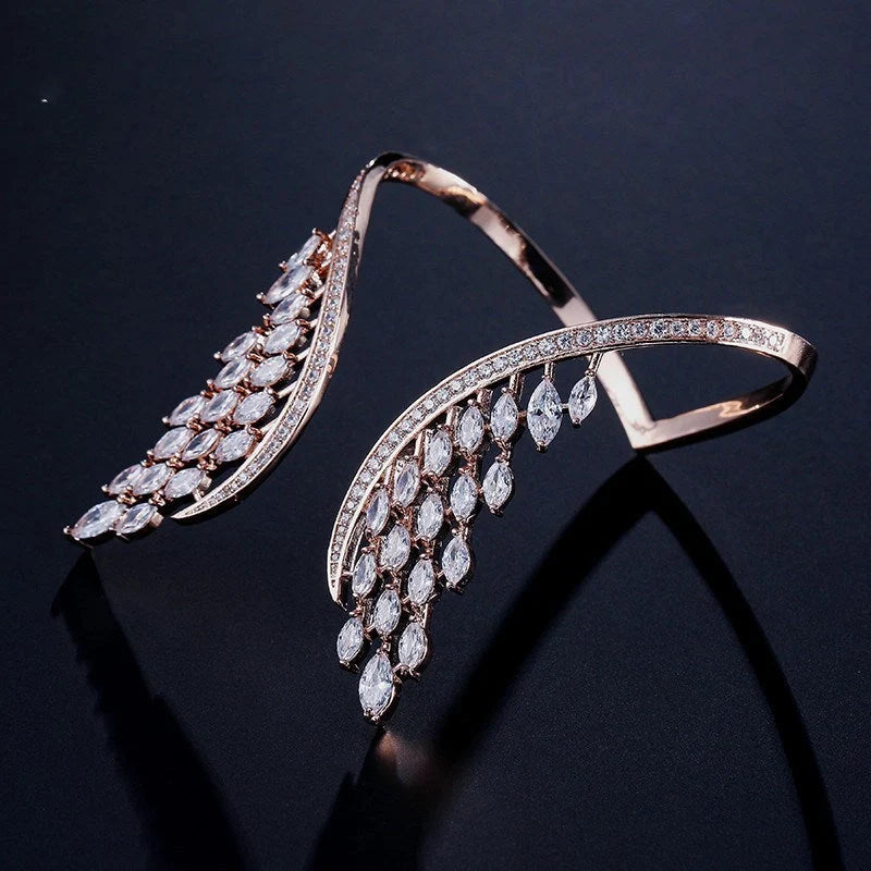 Angel wings ladies bracelet in rose gold, gold, and platinum finishes with geometric design and zircon inlay