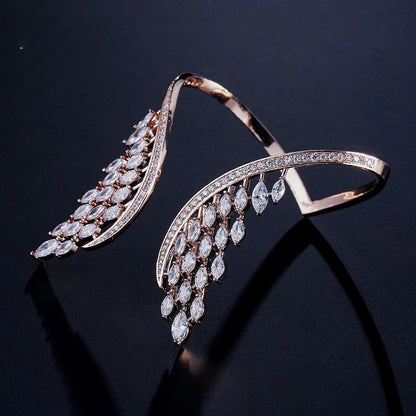 Angel wings ladies bracelet in rose gold, gold, and platinum finishes with geometric design and zircon inlay