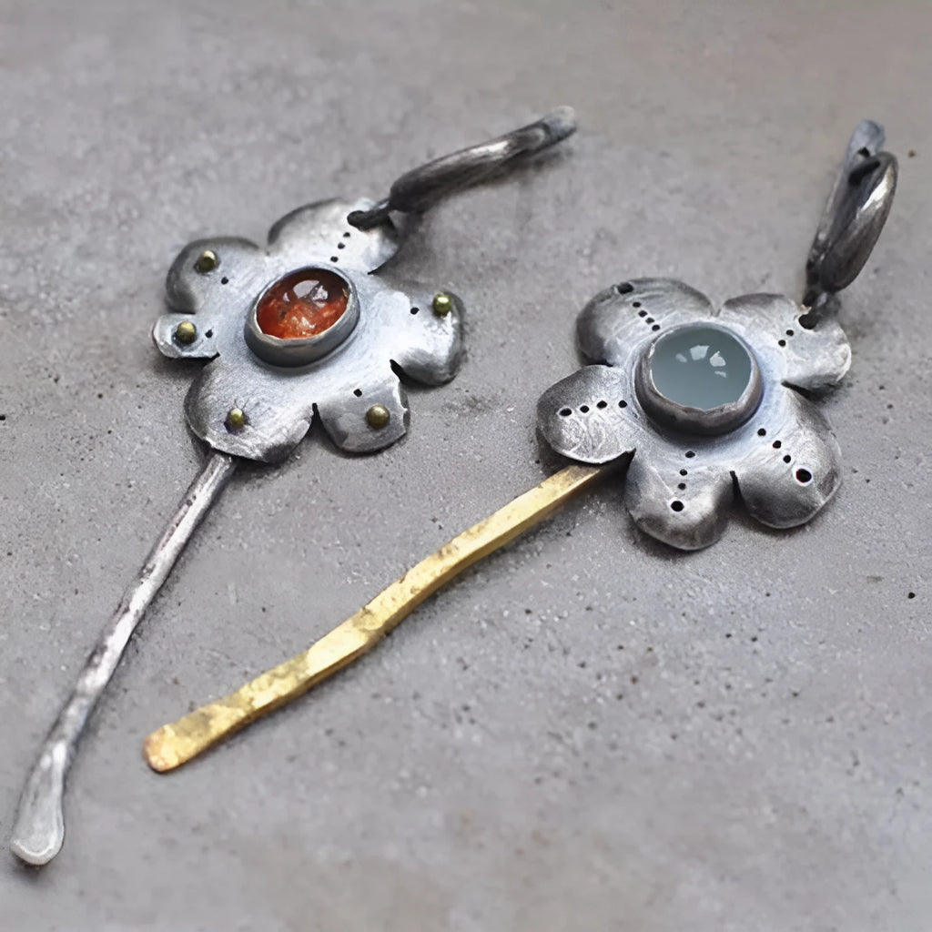 Long geometric flower earrings with retro styling and asymmetric two-colour electroplated finish