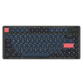 Ajazz AK832PRO green or tea coloured compact mechanical keyboard with RGB backlighting on a desk.