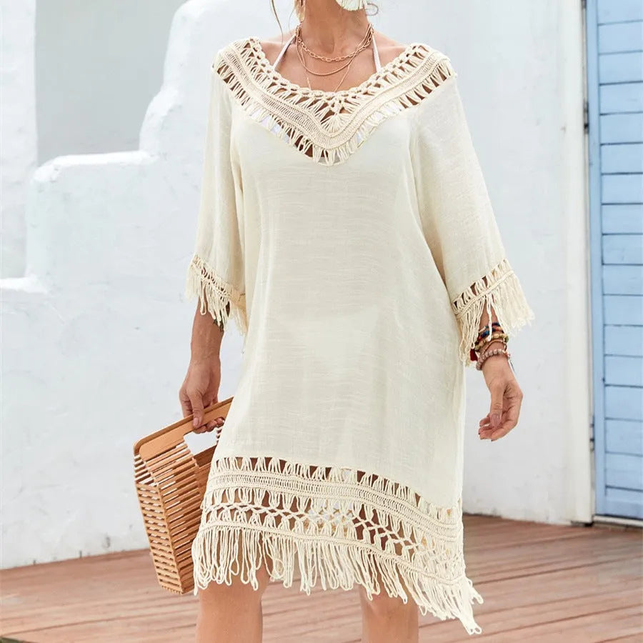 Apricot crocheted patchwork knitted dress with half sleeves on a person.