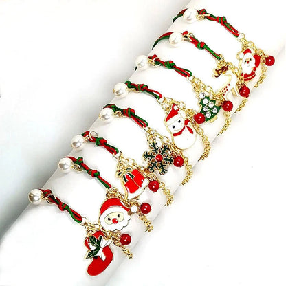 Christmas charm bracelet with snowman, Santa Claus, and snowflake designs