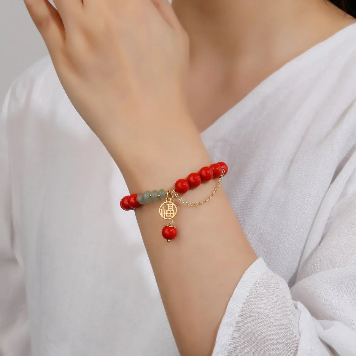 Women's retro bracelet with red sand cinnabar, jade spacer beads, and fu character charm