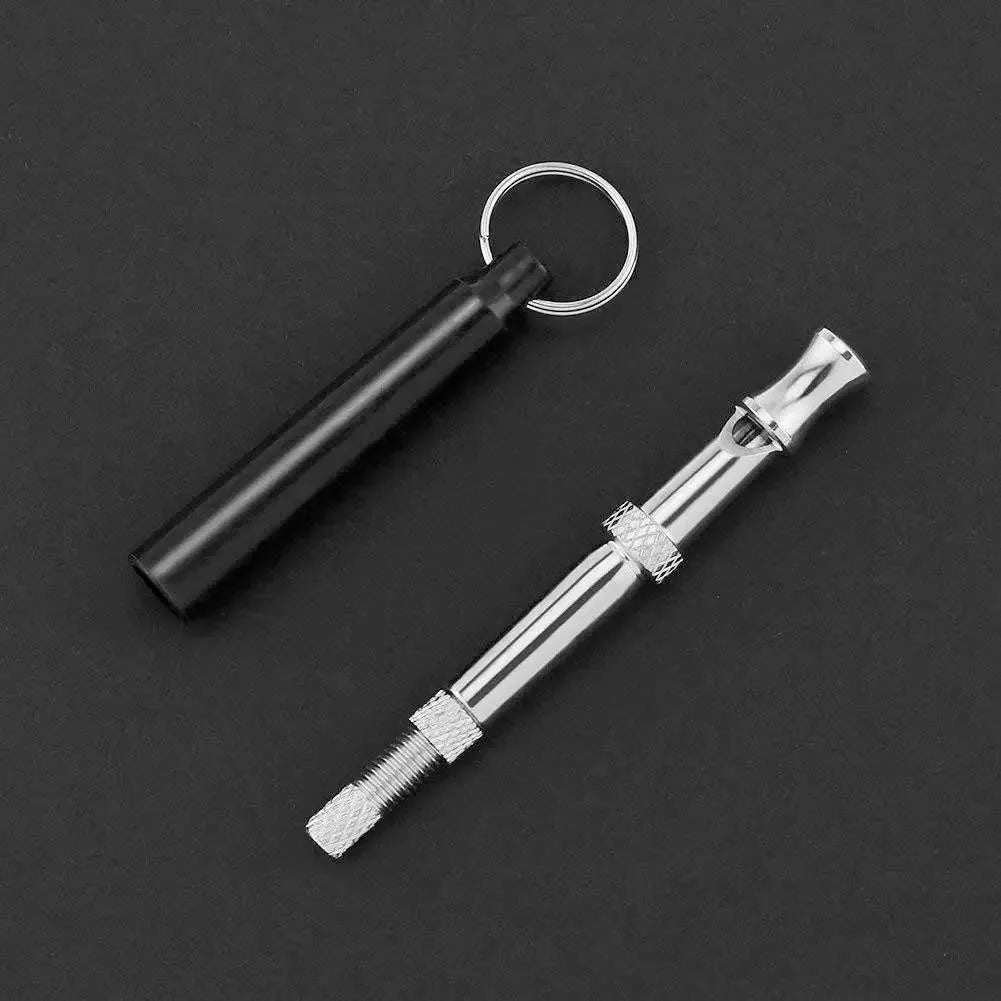 Copper ultrasonic dog training whistle with keychain ring and folding cord on white background