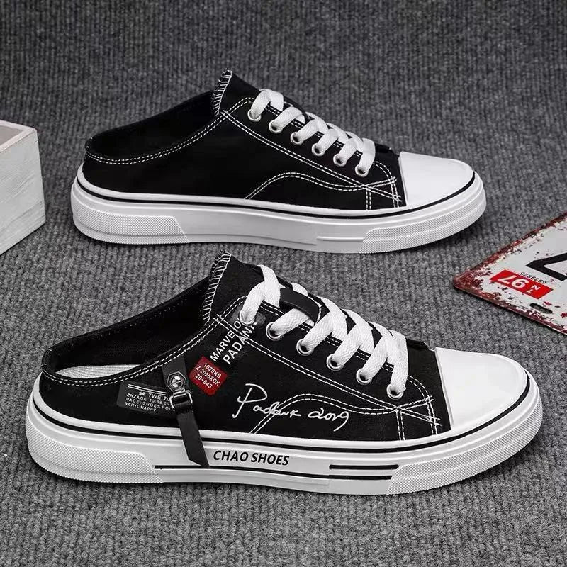 Men's black canvas slip-on casual shoes with round toe and injection moulded sole.