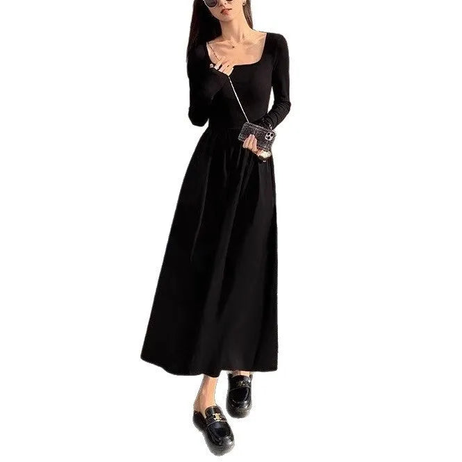 Black knitted square collar dress with long sleeves and an A-line skirt on a mannequin.