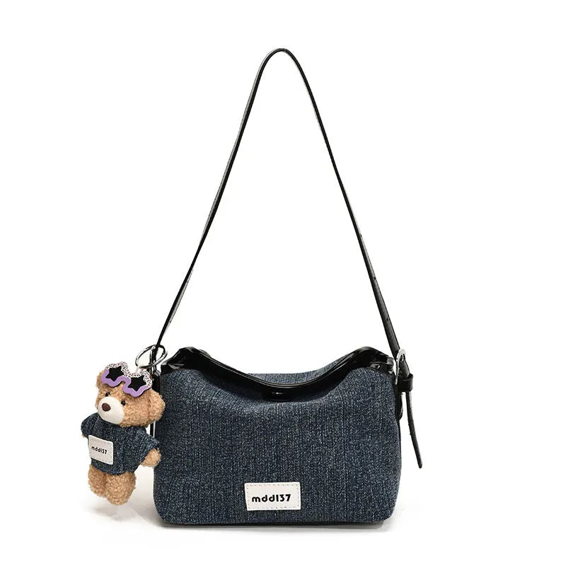 Denim small crossbody bag in black with slit pocket, horizontal square shape, medium hardness, polyester lining.