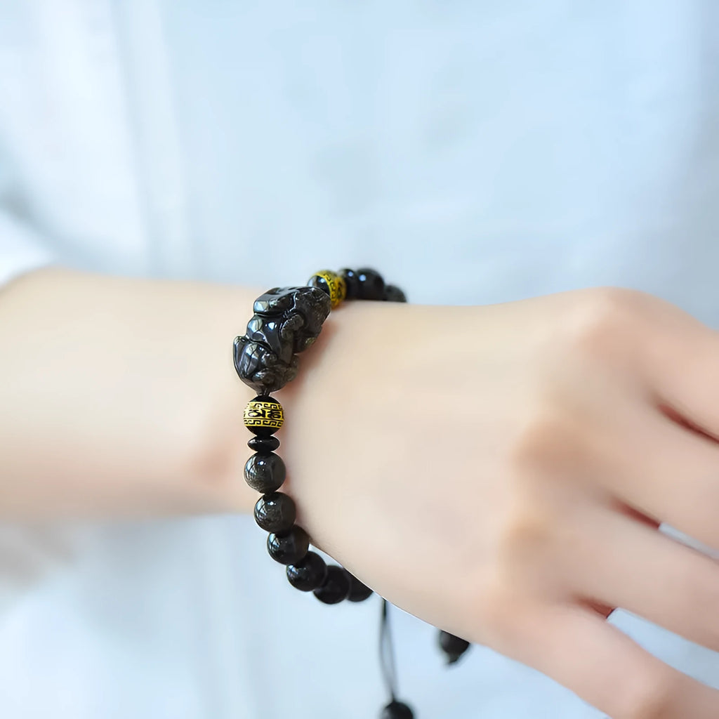 Hand-woven golden obsidian Pi Xiu bracelet with Chinese zodiac design