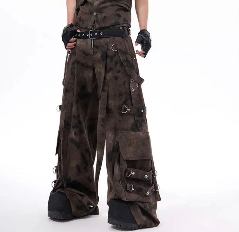 Camouflage pattern denim vest and matching trousers laid flat, showing button front and semi-high collar.