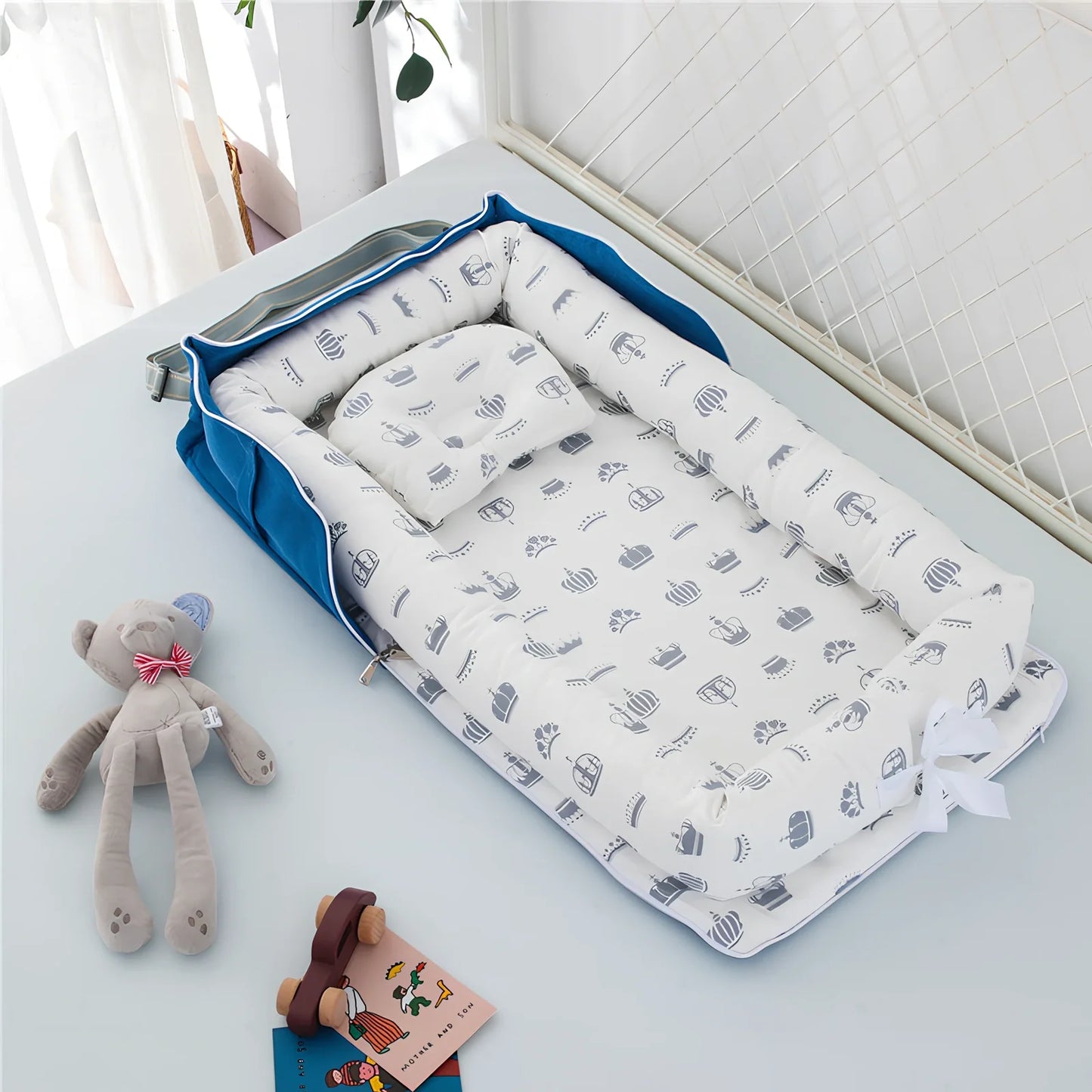 Foldable cotton portable baby crib in Animal World Blue, 90x50 cm with pillow and strap, weighing 1.3 kg