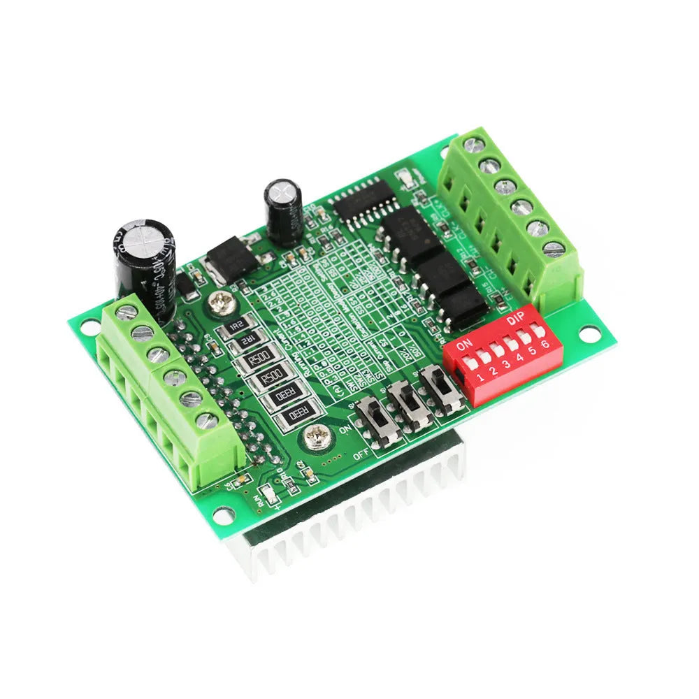 TB6560 stepper motor driver module on a green PCB with a large heatsink, showing connection terminals.