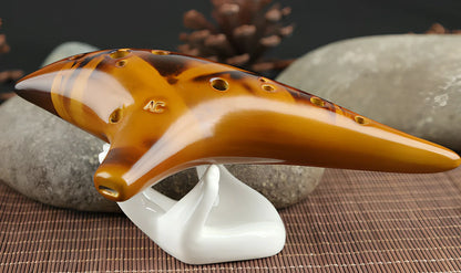 Yellow 12-hole ceramic ocarina in Alto C with 13-note range and integrated lanyard