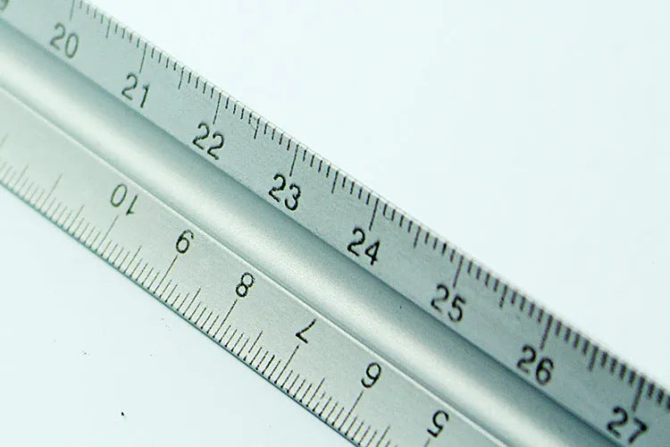 30cm silver metal architect technical triangle ruler on white background