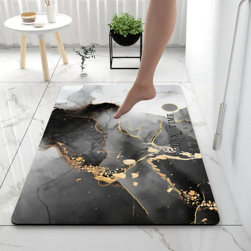 Absorbent and anti-slip bathroom or kitchen floor mat made of diatom mud fabric, sponge, and rubber for moisture control and traction
