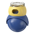Yellow and blue plastic owl-shaped tumbler puzzle feeder for cats on a plain background.