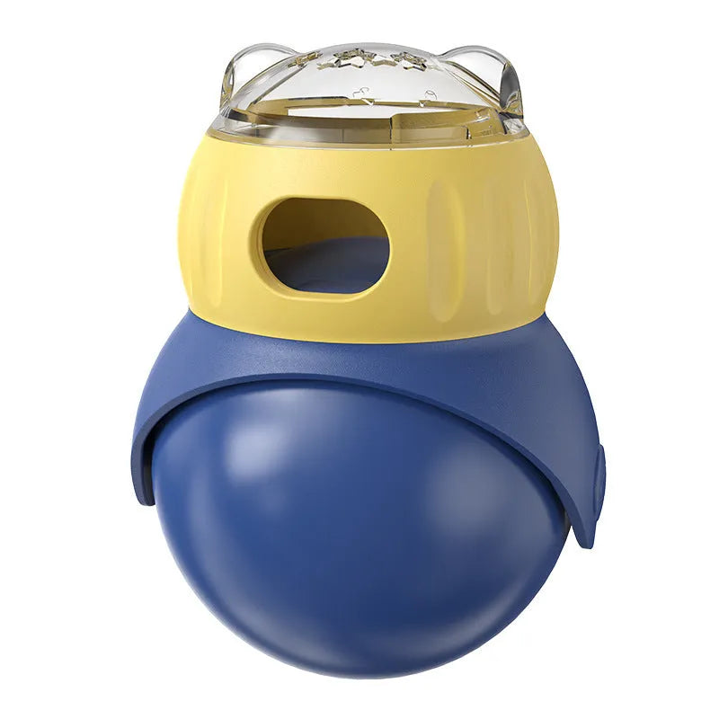 Yellow and blue plastic owl-shaped tumbler puzzle feeder for cats on a plain background.