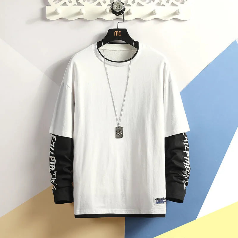 Fake two printed round collar cotton blend t-shirts in black, light grey, and white on a neutral background