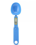 Digital spoon kitchen scale with LCD display showing weight measurement in grams