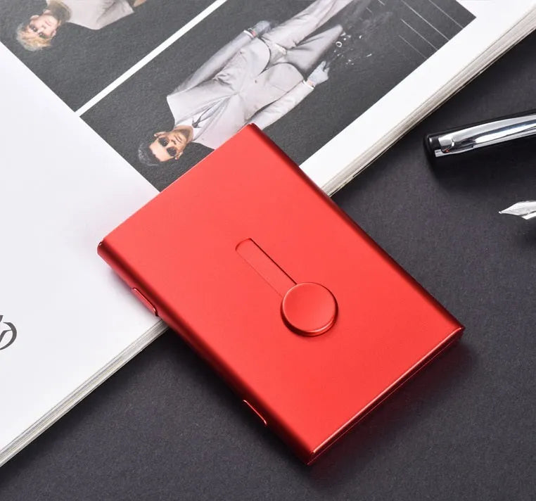 Hand push aluminium business card case in silver shown open with cards and internal layers visible