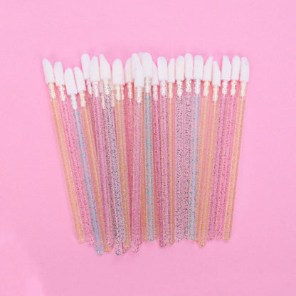 Crystal rod lip brush with synthetic fibre bristles in six colour options on white background