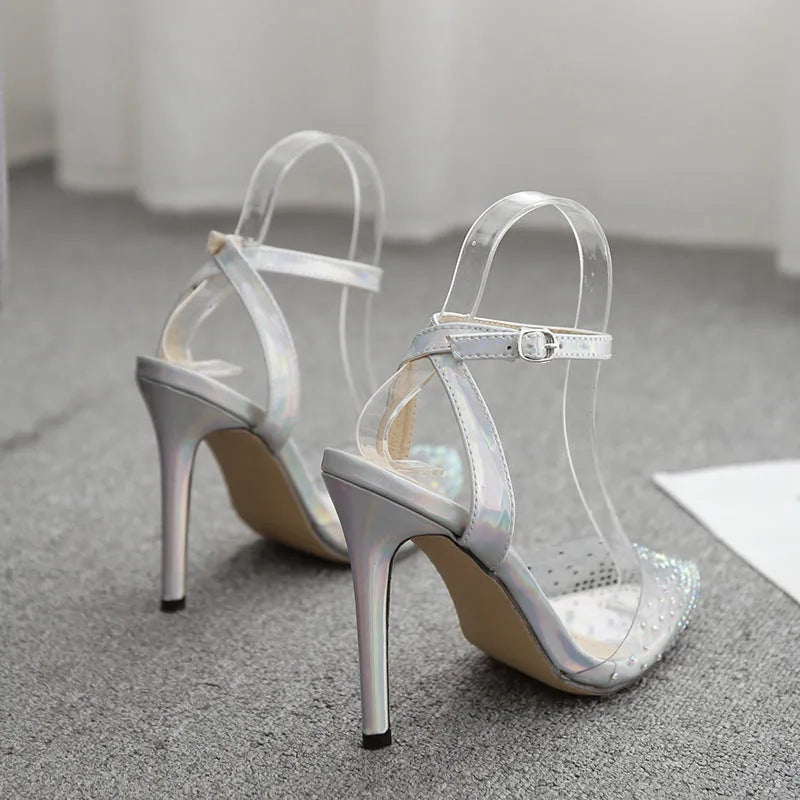 Women's pointed toe diamond embellished sandals with a stiletto heel on a white background.