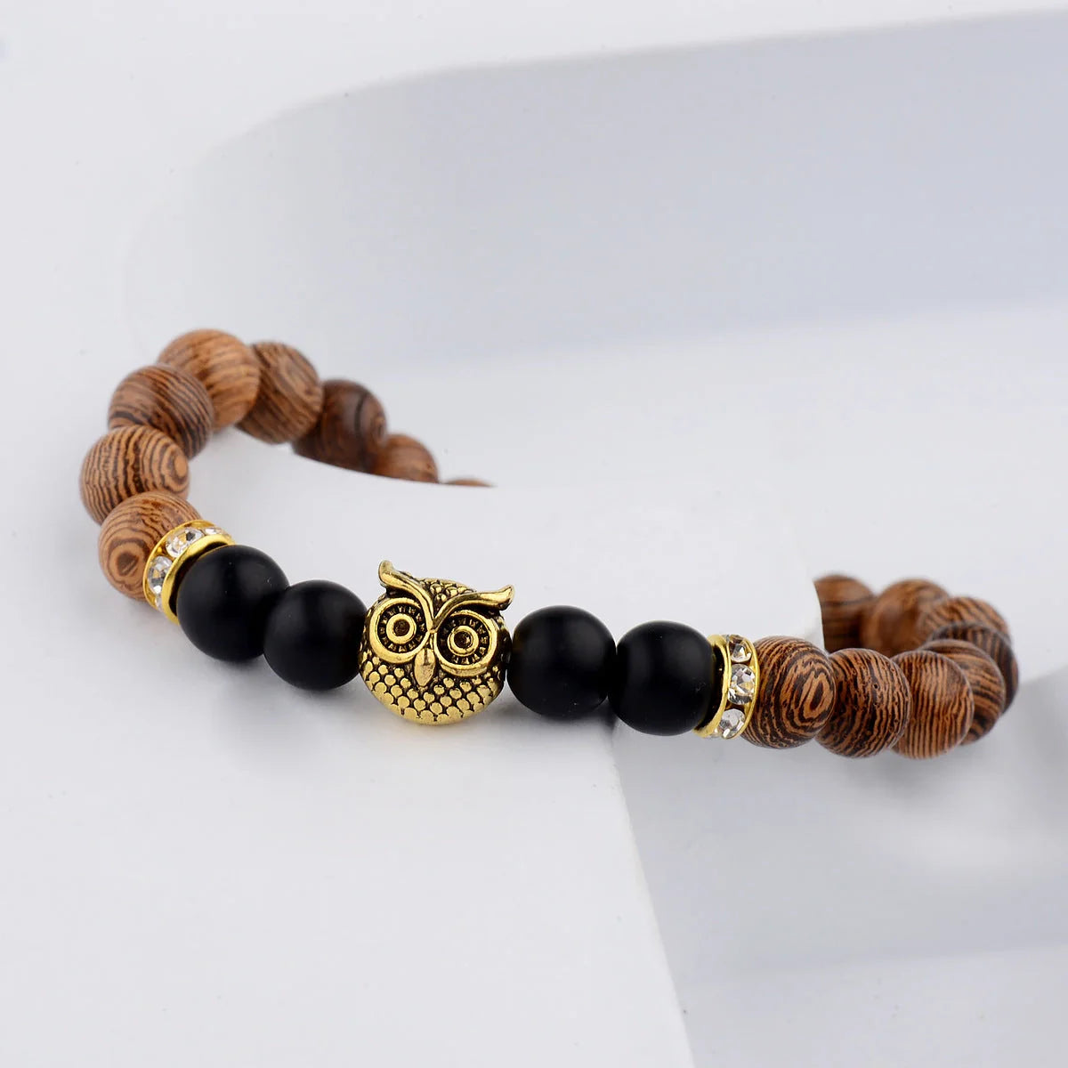 Owl frosted stone lifeline wood grain bracelet in black and gold, adjustable for a perfect fit