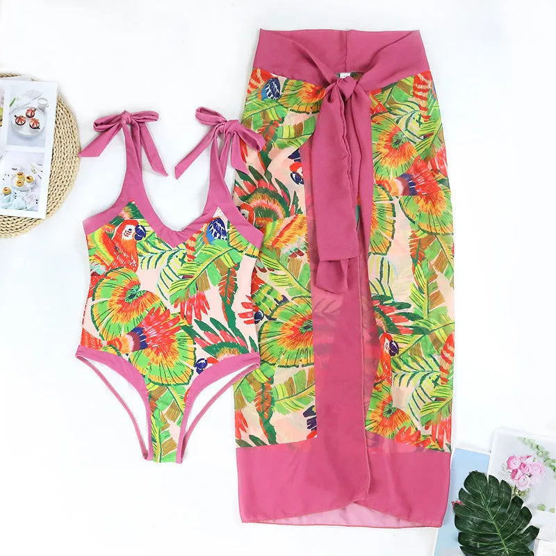 Women's pink retro one-piece swimsuit with V-neck, backless design and thin skirt cover