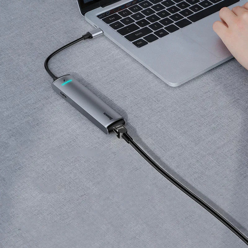 Non-Apple branded Type-C docking station in dark grey with mechanical eye design compatible with MacBook and iPhone