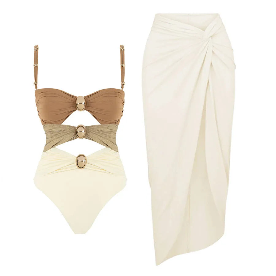 Women's solid colour one-piece swimsuit with detachable skirt featuring gold button detail
