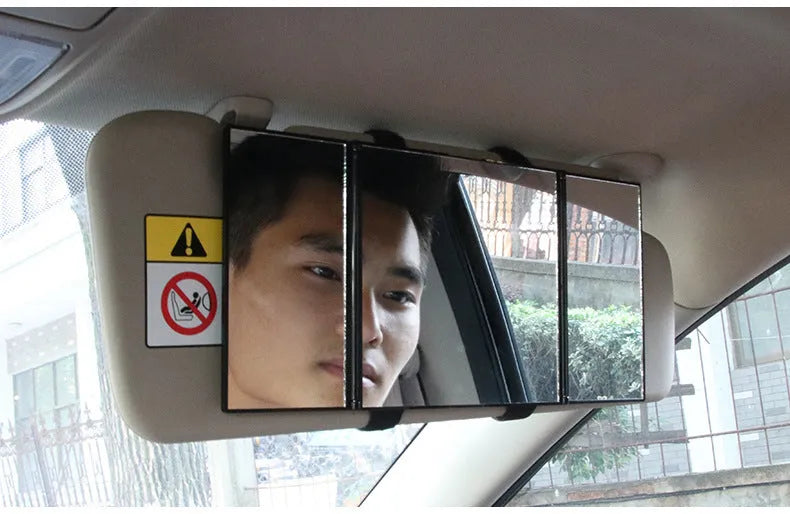 Silver car folding grooming mirror shown opened and closed on a car dashboard.