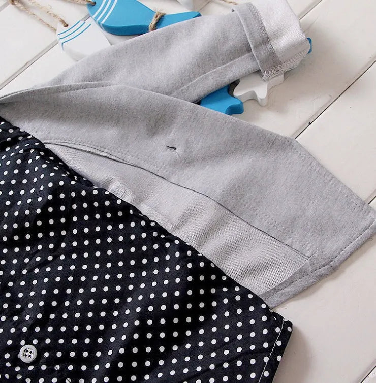 Blue children's casual sport suit tracksuit set with short sleeve top and elastic waist shorts on a hanger.