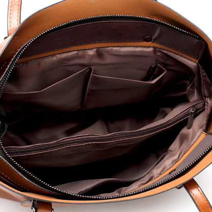 Black oil leather tote bag with square shape, zipper top, soft handle, and internal pockets for winter use