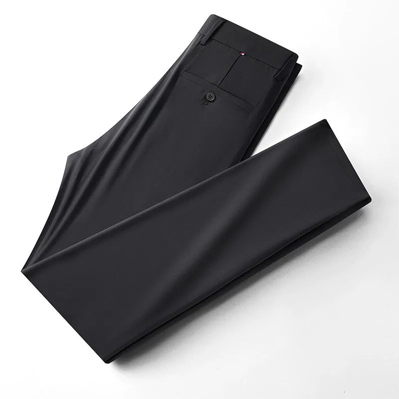 Pair of men's summer ice silk straight-leg suit trousers in solid colour on white background